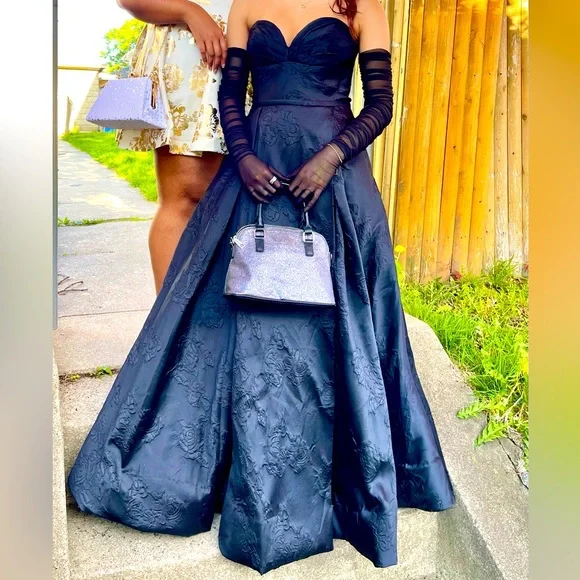 Beautiful black dress. Heavy material. Pattern of Roses somewhat.